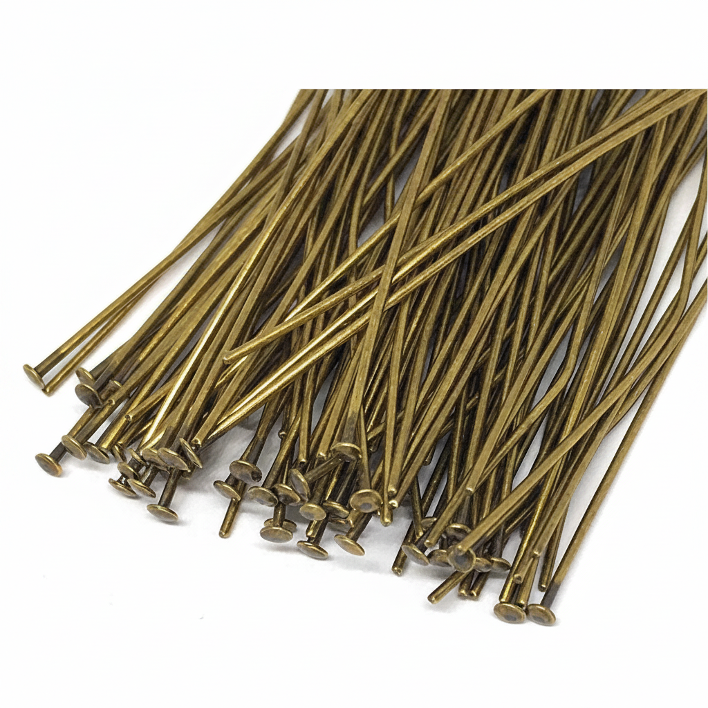 A pile of long, thin metallic pins with round heads, shown on a plain white background.