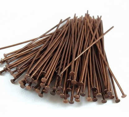 A pile of brown metal nails with round heads, arranged on a plain white background.