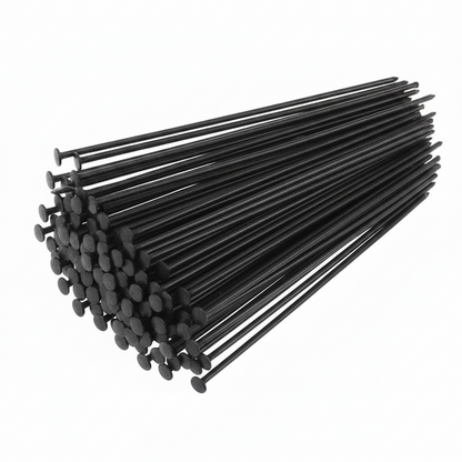 A bundle of black pins with round heads, arranged diagonally on a plain white background.