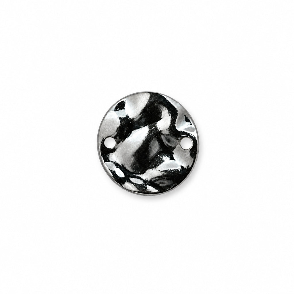 A round silver-toned metal disc with two pre-drilled holes, featuring a marbled or swirled metallic pattern, shown on a plain white background.