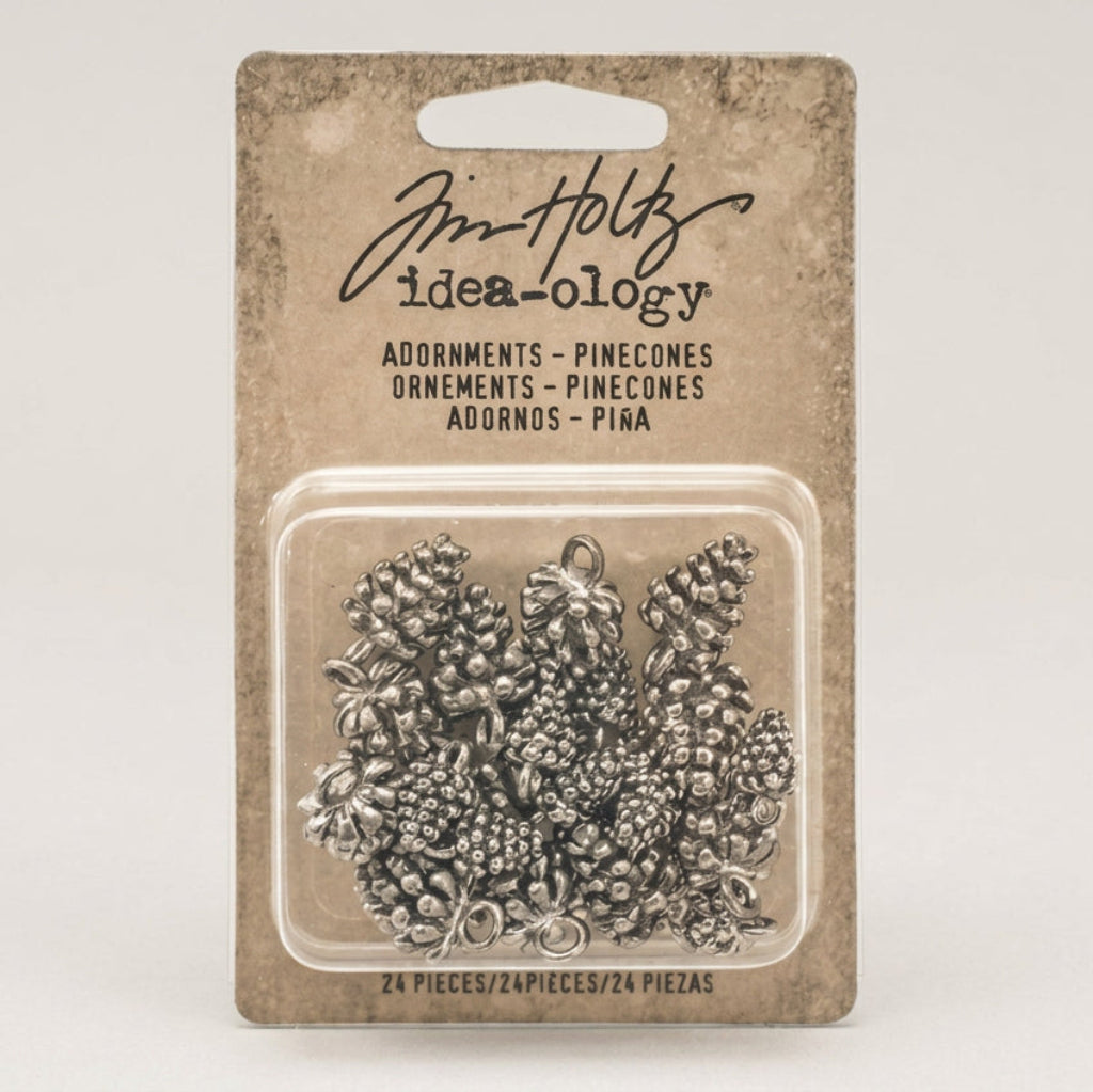 Tim Holtz Idea-Ology pinecone ornaments packaging on a white background