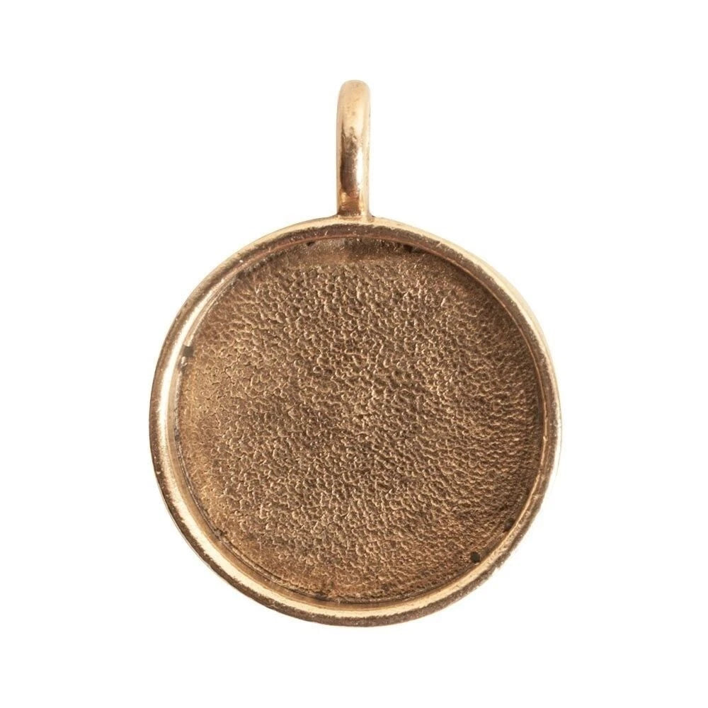 A round, bezel-set gold pendant or charm blank with a textured center and a small top loop, shown on a plain white background.