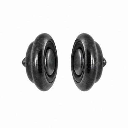 A pair of dark gray metallic round CLASP with a central oval cutout, shown against a plain white background.