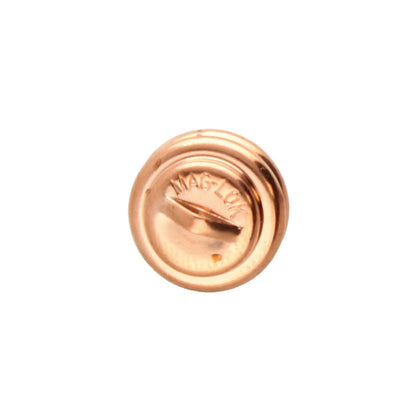 A single round metallic pin or badge shown from the back on a plain white background. The metal has a warm copper/rose-gold tone, and the word MAG-LOK is embossed on the surface.