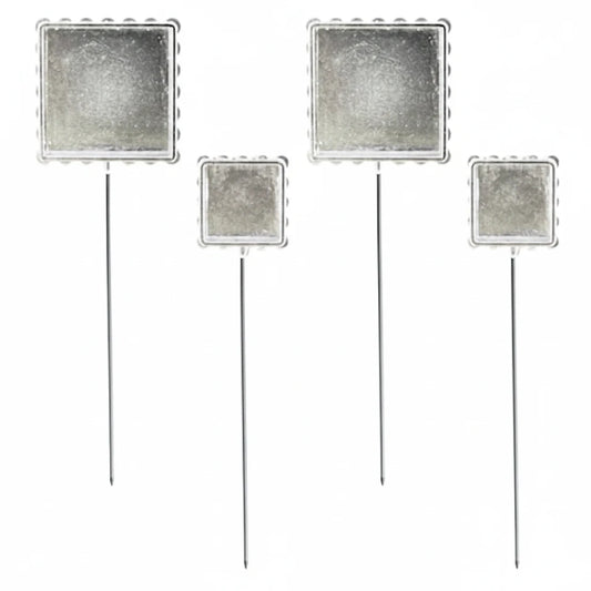 Four square silver glitter photo booth props with metal stakes on a plain white background.