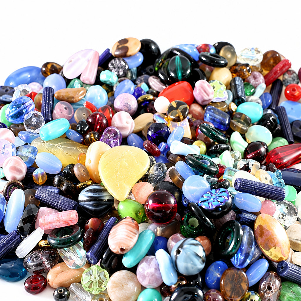 A close-up pile of assorted colorful glass beads and small jewelry components, including heart-shaped beads, striped beads, barrel beads, and polished stones in many hues.