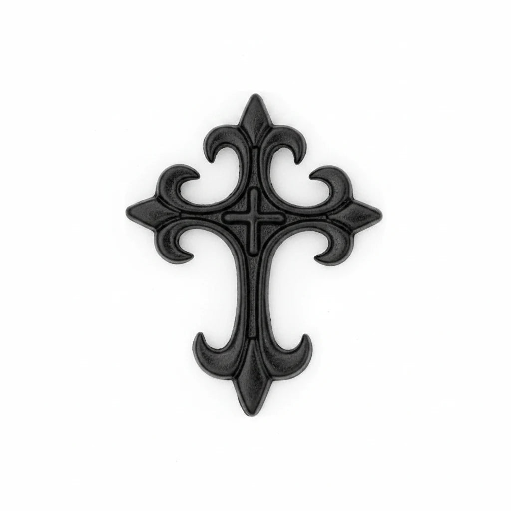 A black ornate cross-shaped patch or emblem with decorative scrollwork, shown on a plain white background with a dashed line above it.