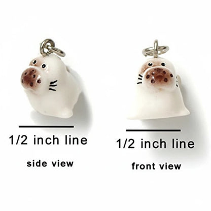 A small white animal charm shown from side and front views on a white background, with measurement labels reading 1/2 inch line beneath each view.