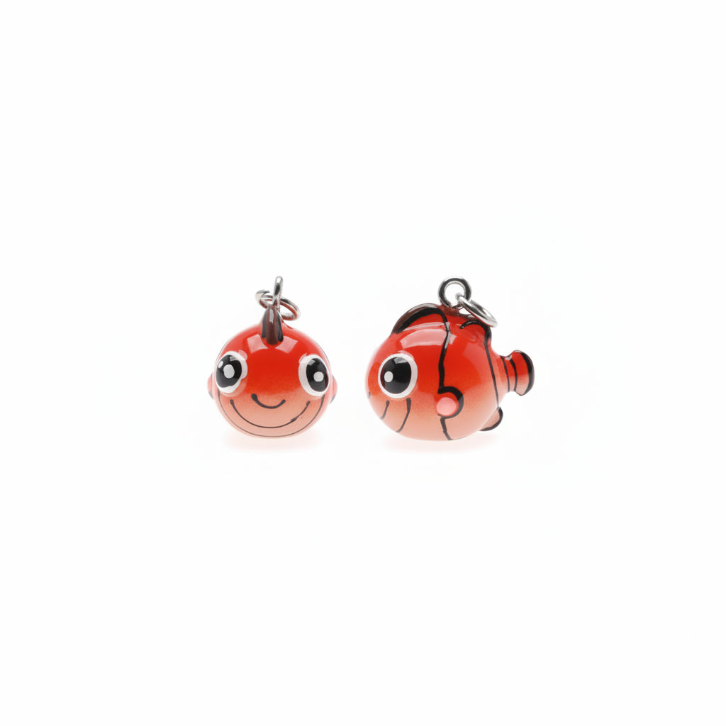 Two small red clownfish-shaped charms with black stripes, white eyes, and silver hanging loops on a plain white background.