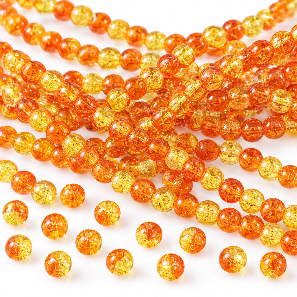 Multiple strands of translucent orange-yellow round beads with a silver coin and black ruler for scale on a white background.