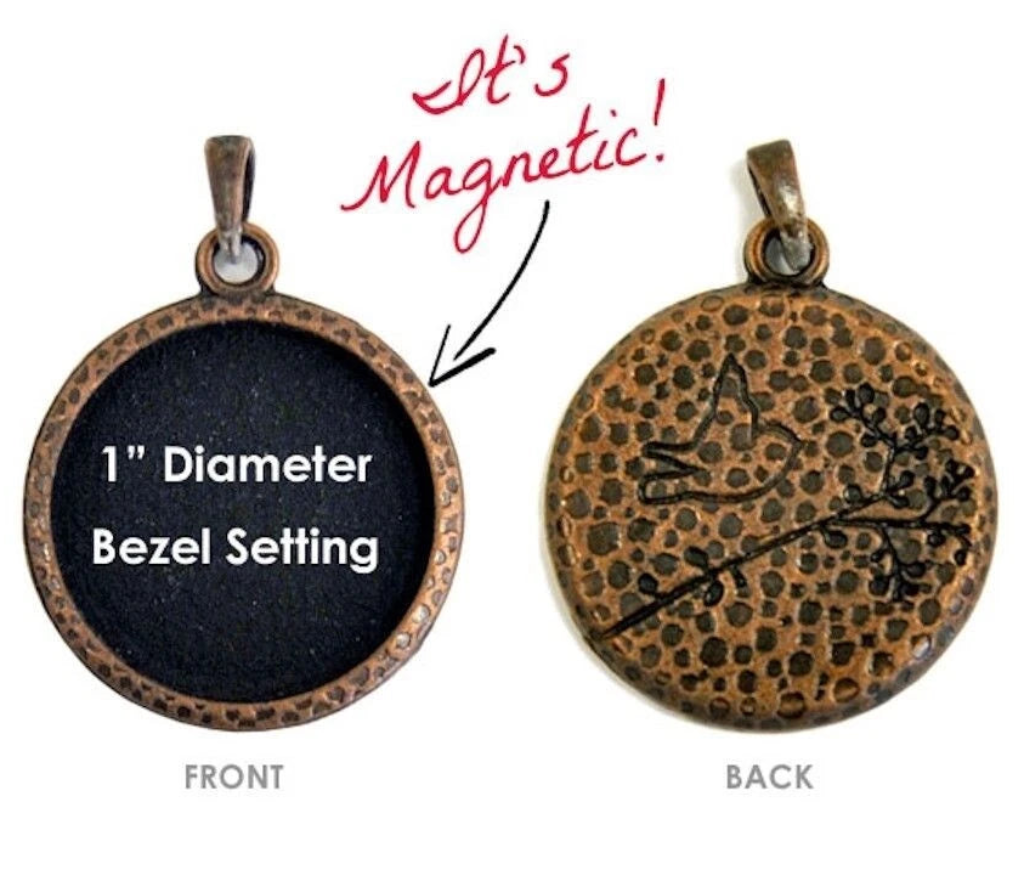 A 1-inch diameter bezel setting pendant shown from both front and back on a white background. The front side is black with white text reading '1" Diameter Bezel Setting,' and the back side shows a copper-toned hammered metal rim with a black bird engraving.