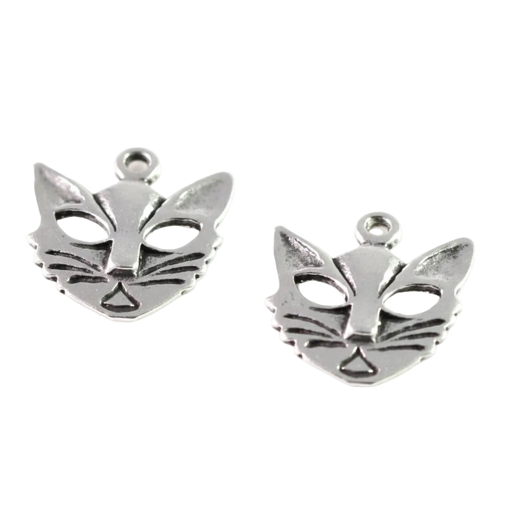 Two silver cat face charms with small loops at the top, displayed on a plain white background.