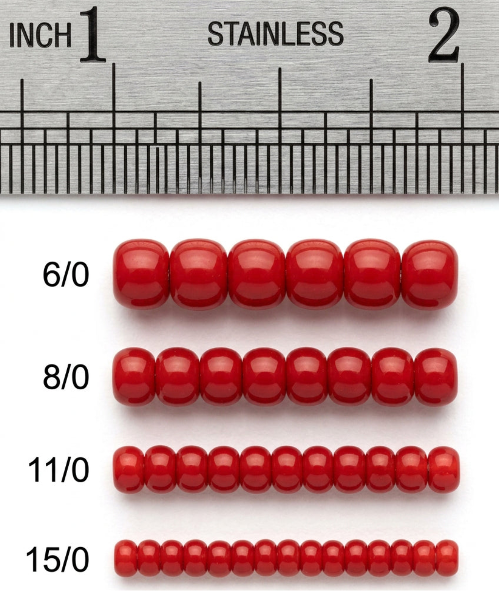 Red glass seed beads shown in four sizes (6/0, 8/0, 11/0, 15/0) aligned below a stainless steel ruler for scale.