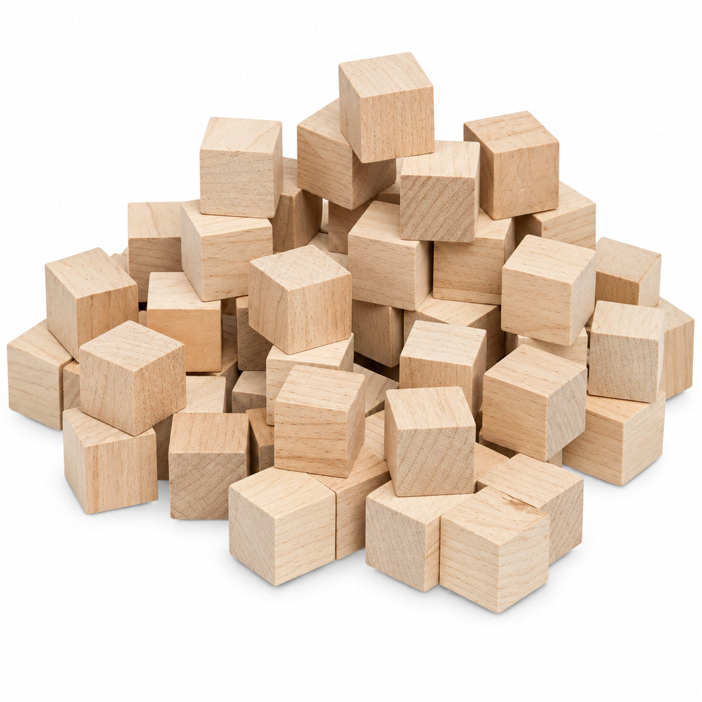 A pile of small unfinished wooden blocks in a light natural wood tone, arranged on a plain white background.