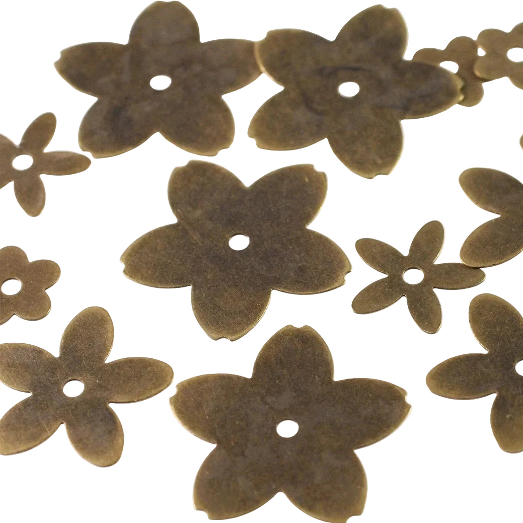 A set of brass flower-shaped craft beads with a single hole in the center, displayed on a plain white background.