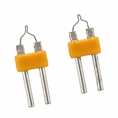 Two small electronic components with orange-yellow plastic bodies and silver metal leads, shown on a plain white background.