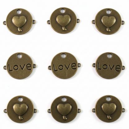 Nine round antique bronze metal charms arranged in a 3x3 grid on a white background. Each charm features a small heart at the top and the word 'Love' across the center in an engraved serif font.