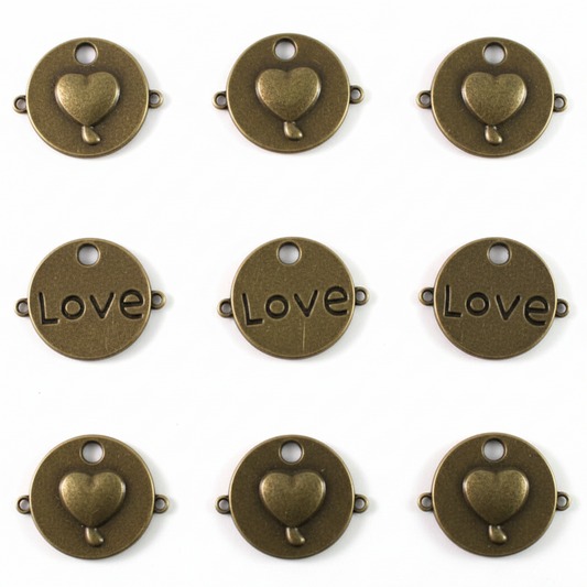 Nine round antique bronze metal charms arranged in a 3x3 grid on a white background. Each charm features a small heart at the top and the word 'Love' across the center in an engraved serif font.