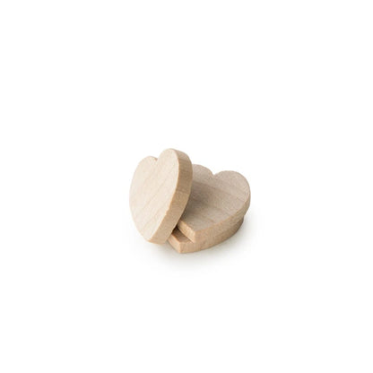 Two small unfinished wooden heart-shaped blocks, one leaning against the other, on a plain white background.