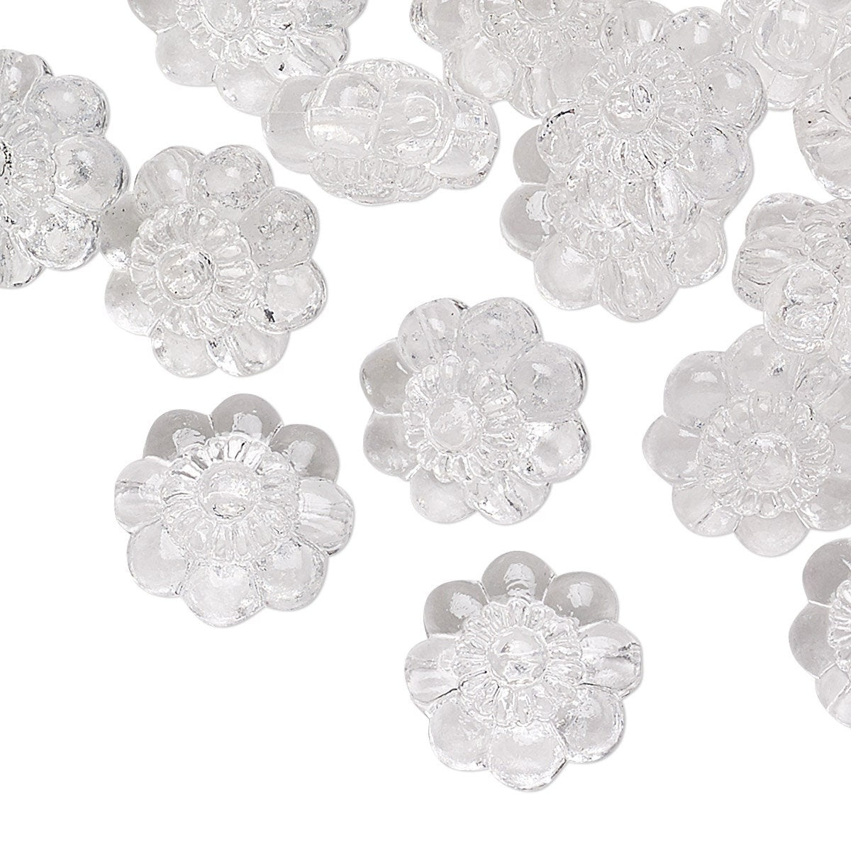 Clear flower-shaped beads on a white background