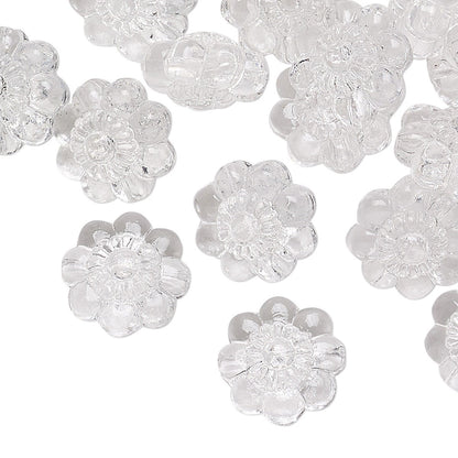 Clear flower-shaped beads on a white background
