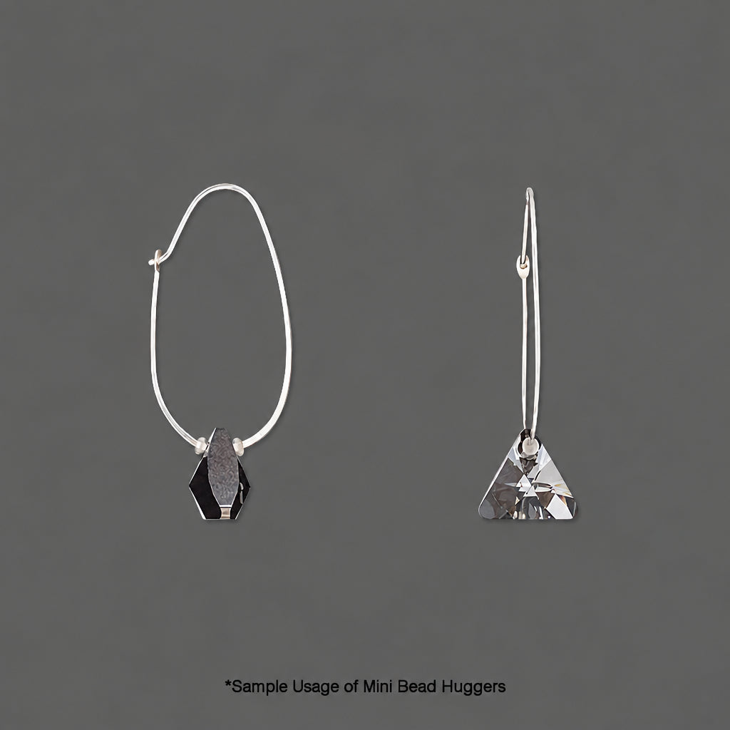 Two silver-tone mini bead huggers shown on a dark gray background, one as a front view with a faceted black hexagonal bead and the other as a side view with a faceted silver triangular bead. Text at the bottom reads '*Sample Usage of Mini Bead Huggers'.