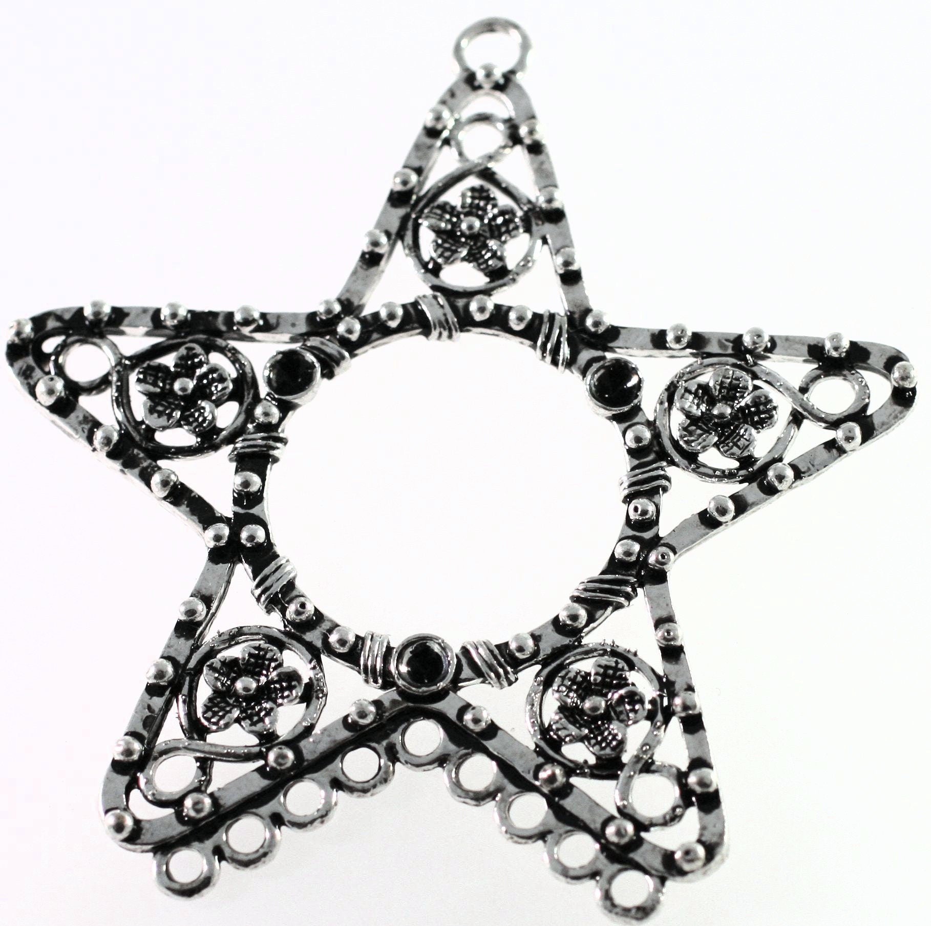 Decorative star-shaped object with intricate patterns on a white background