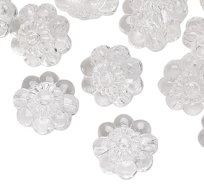Clear flower-shaped beads on a white background