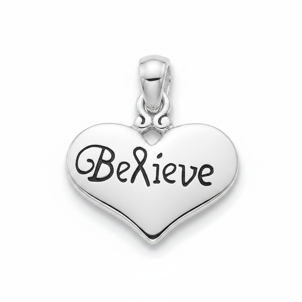 A polished silver heart-shaped pendant engraved with the word 'Believe' in black cursive script, shown on a clean white background.