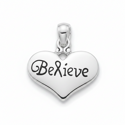 A polished silver heart-shaped pendant engraved with the word 'Believe' in black cursive script, shown on a clean white background.