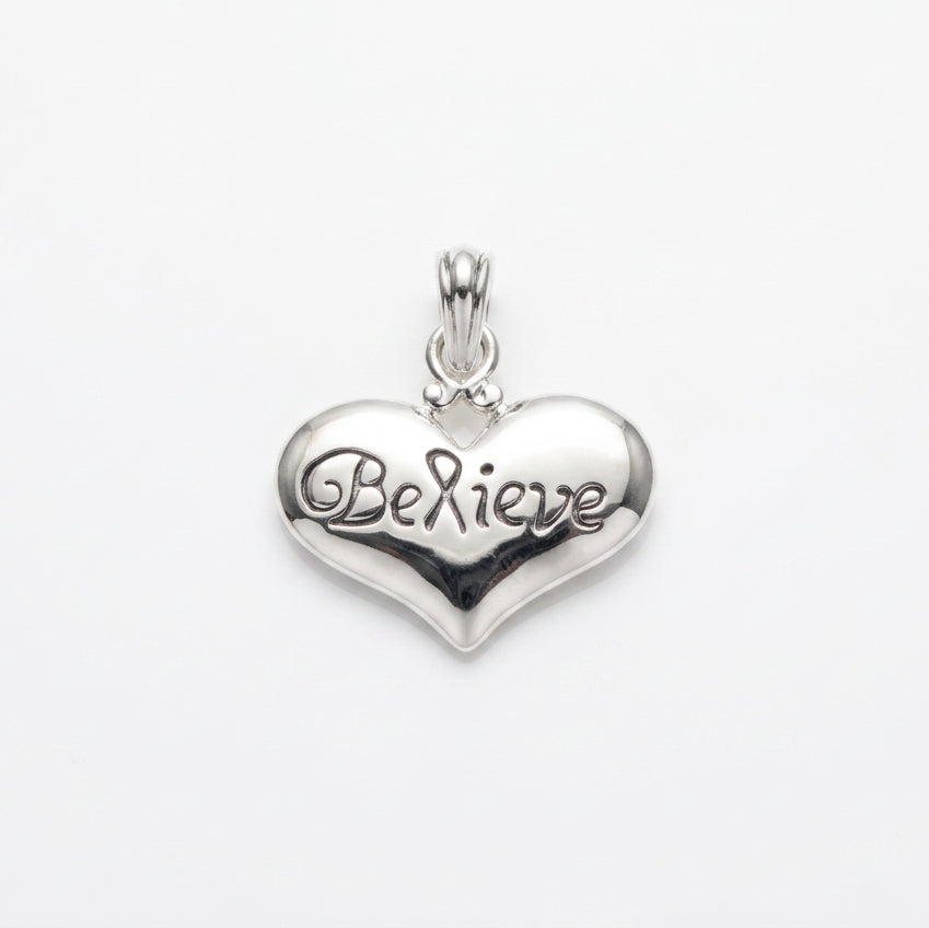 A polished silver heart-shaped pendant engraved with 'Be Mine' on a plain light gray background.