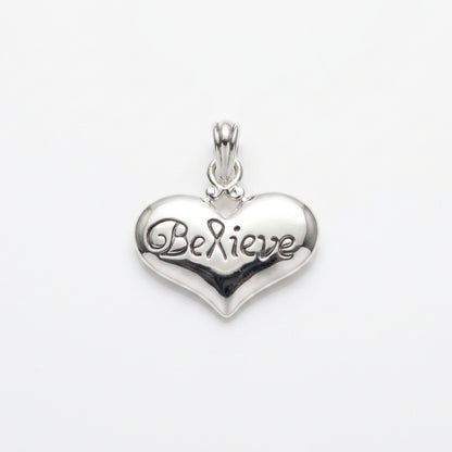 A polished silver heart-shaped pendant engraved with 'Be Mine' on a plain light gray background.