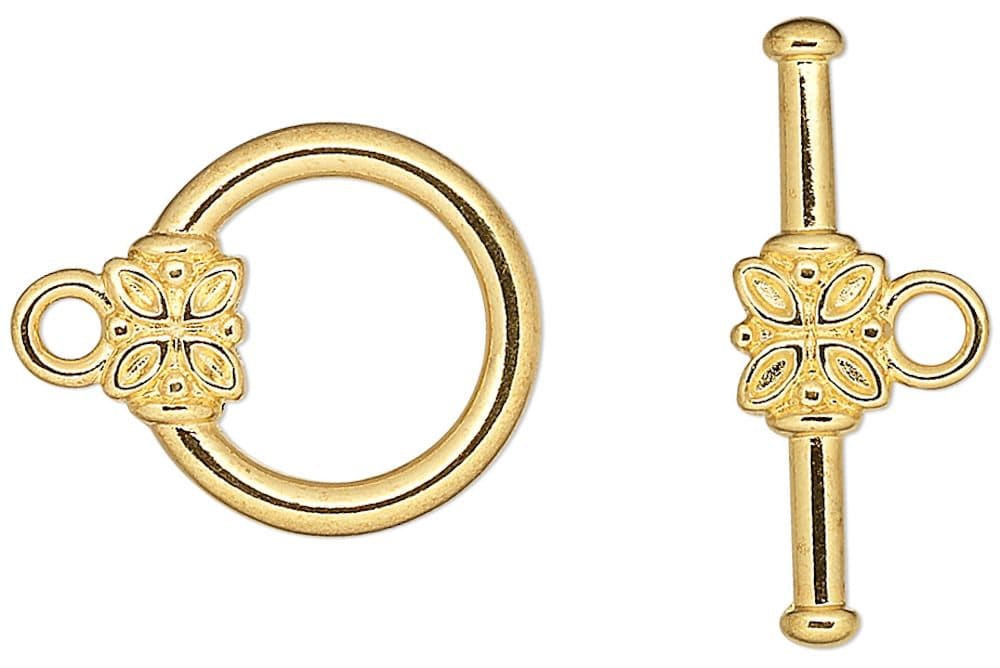 Gold toggle clasp on a white background
