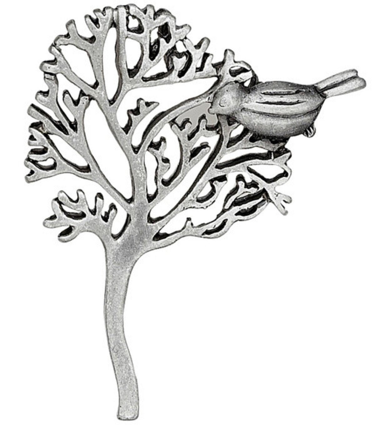Silver  tree design and a bird perched on a branch.