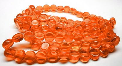 Orange glass beads on a white background