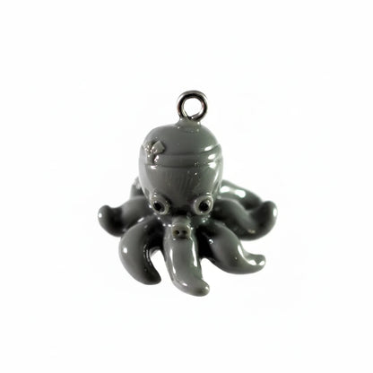 A glossy dark gray octopus-shaped charm or pendant with a metal loop at the top, shown against a plain white background.