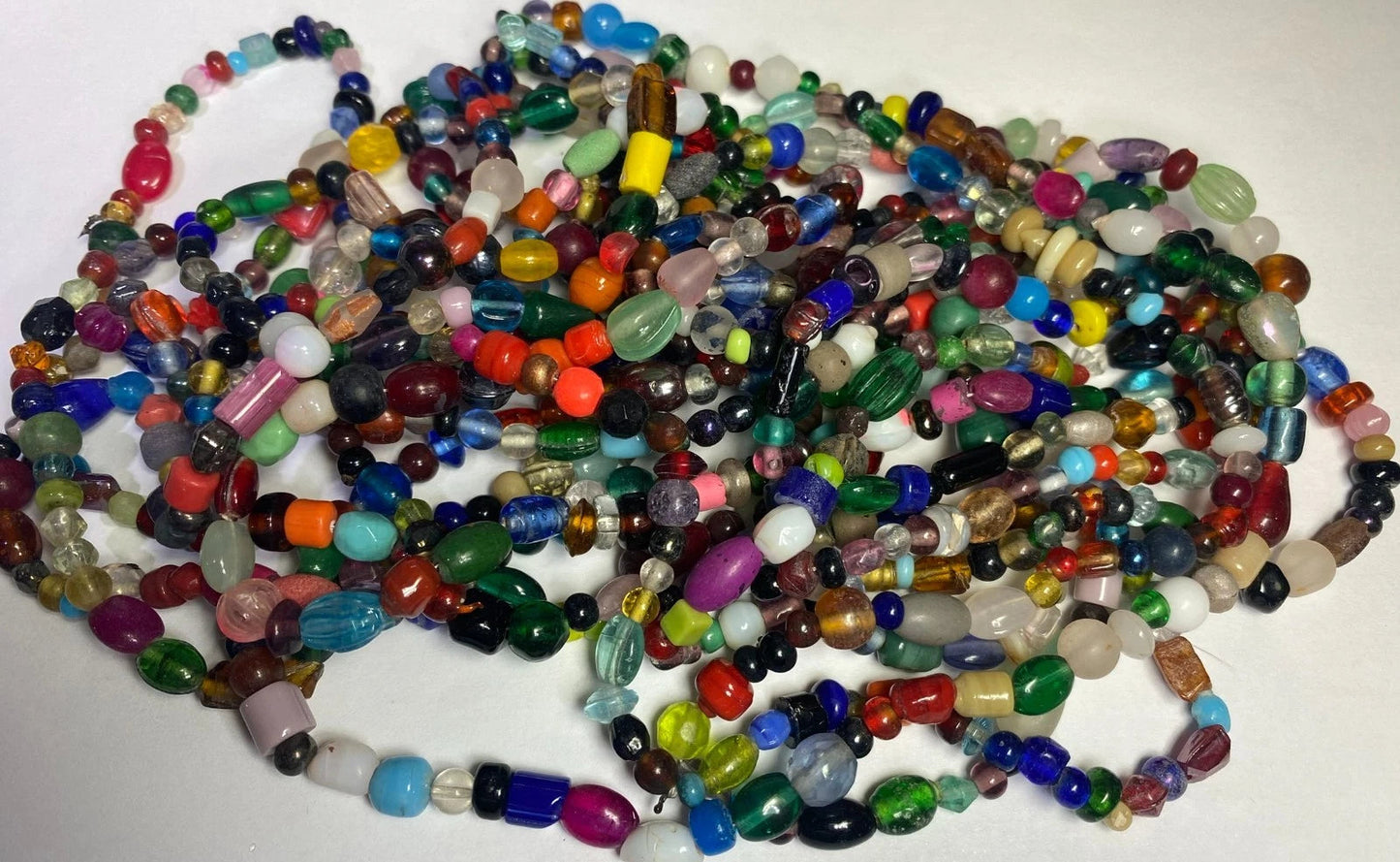 Multicolored beaded strands on a white background