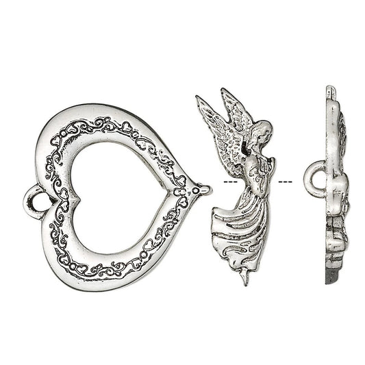 Silver-toned metal jewelry findings set including a heart-shaped clasp with ornate scrollwork, an angel figurine charm, and a side profile view of the clasp on a plain white background.