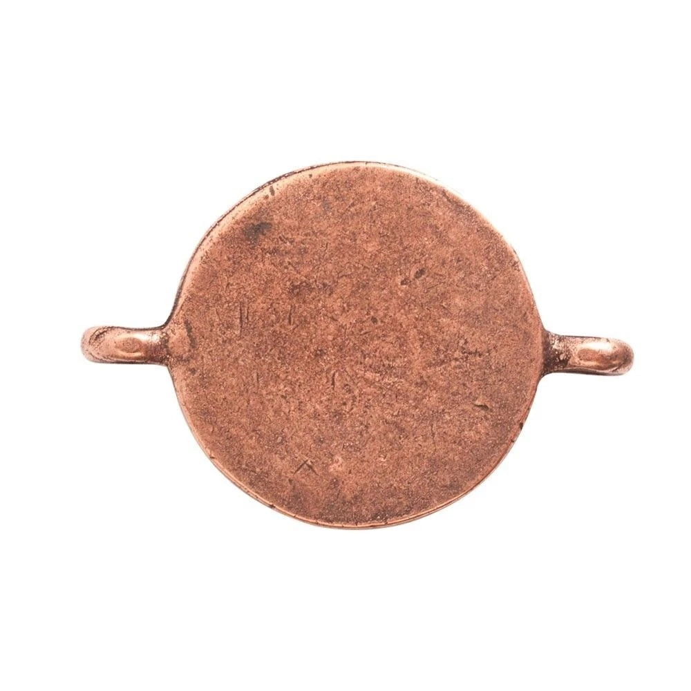 A round copper disc pendant or charm with two small side loops, shown against a plain white background.