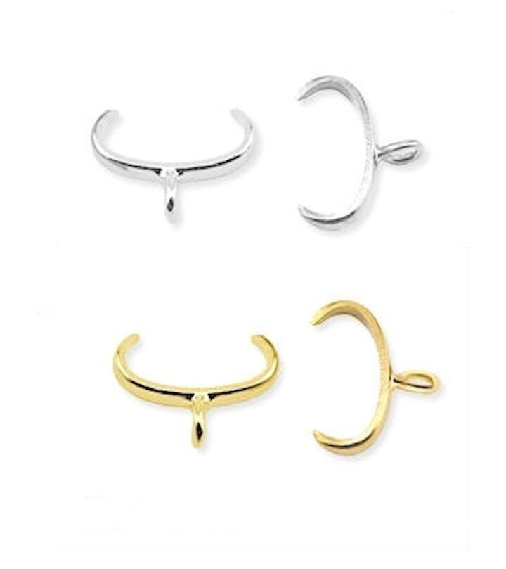 Set of gold and silver crescent-shaped BAILS on a white background