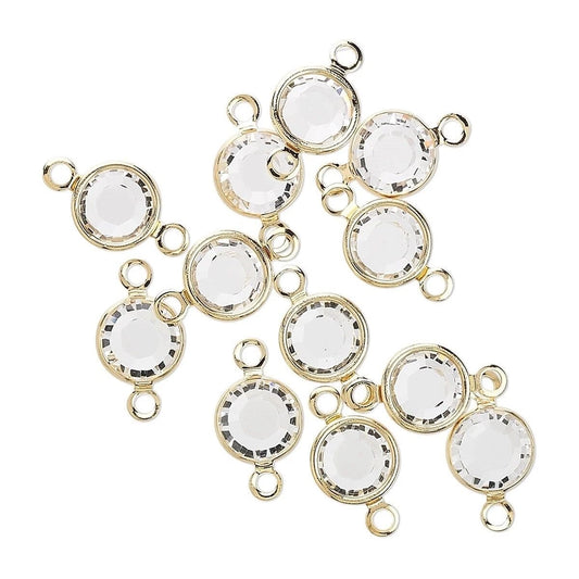 Nine round clear faceted gemstone cabochons with gold-plated bezels and hanging loops, arranged on a plain white background.