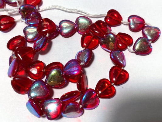 String of red heart-shaped beads on a white background