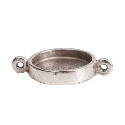 A small oval metal jewelry finding with two looped side tabs, finished in a textured silver-tone or antique silver finish, shown on a plain white background.