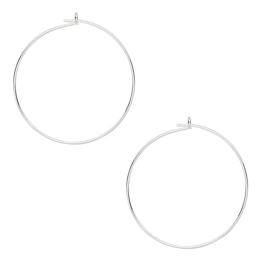 A pair of large, thin silver hoop earrings with small jump rings and post backings, displayed on a clean white background.