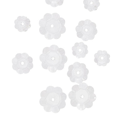 Clear flower-shaped beads on a white background