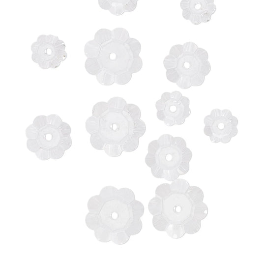 Clear flower-shaped beads on a white background