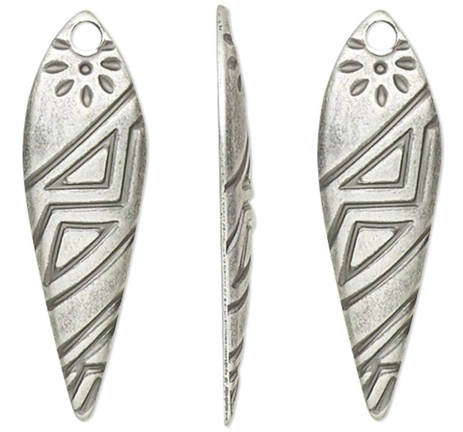 Four silver-toned metal teardrop-shaped findings with engraved geometric and floral patterns, shown on a plain white background.