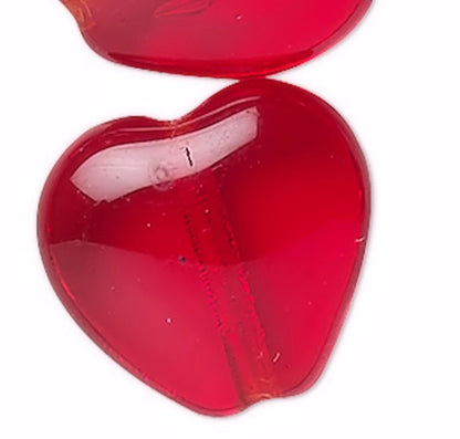 Red heart-shaped object on a white background