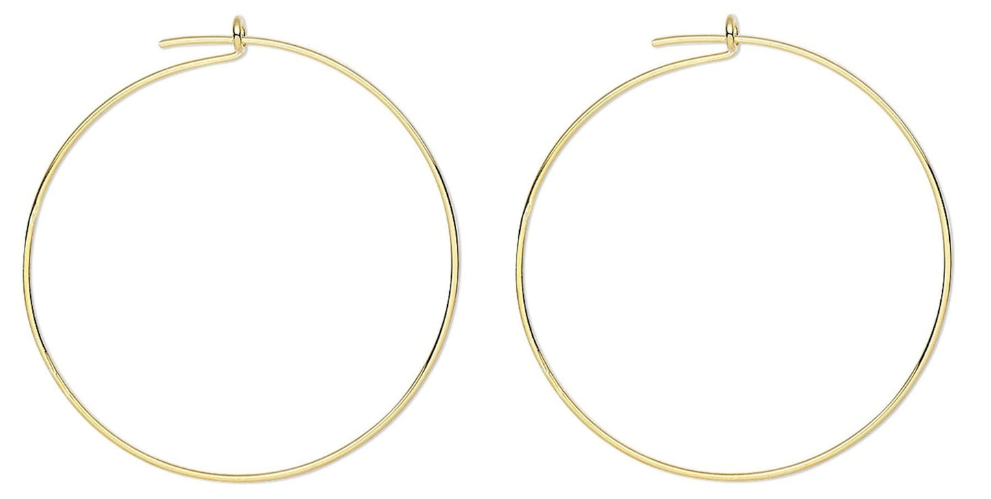 Gold hoop earrings on a white background