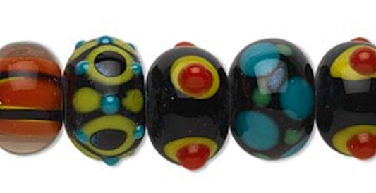 Set of colorful glass beads on a white background